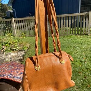 Pebbled leather handbag or computer bag. Long drop.  Lots of interior pockets.